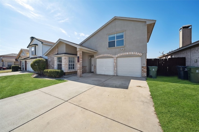 view of front of property with a garage and a front lawn