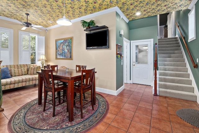 dining area with crown molding, a ceiling fan, stairs, baseboards, and tile patterned flooring