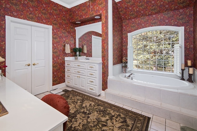 full bath featuring tile patterned floors, wallpapered walls, vanity, a bath, and a closet
