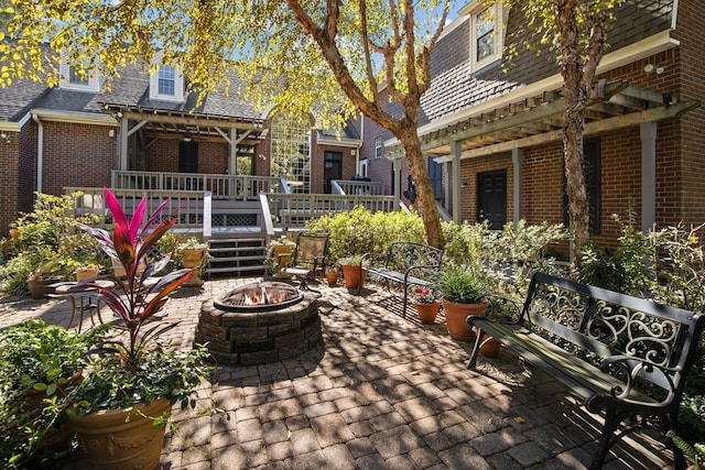 view of patio / terrace featuring an outdoor fire pit