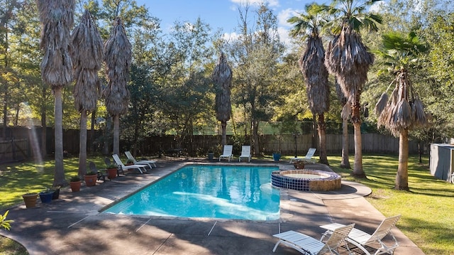view of swimming pool with a patio and a pool with connected hot tub