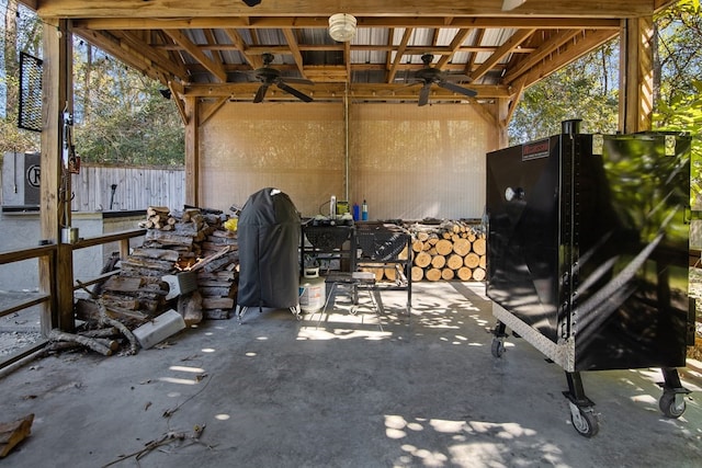 view of patio with a ceiling fan and fence