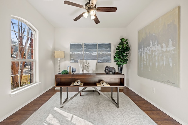 office featuring dark wood-type flooring and ceiling fan