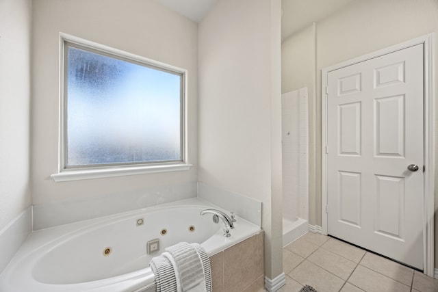 bathroom with tile patterned floors and plus walk in shower