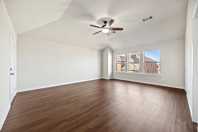 unfurnished room featuring ceiling fan, dark hardwood / wood-style flooring, and vaulted ceiling