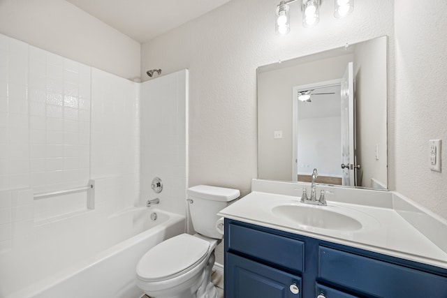 full bathroom featuring toilet, bathtub / shower combination, ceiling fan, and vanity