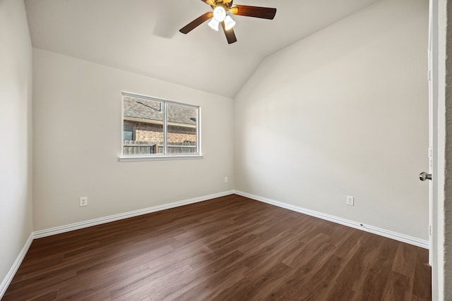 spare room with vaulted ceiling, ceiling fan, and dark hardwood / wood-style floors