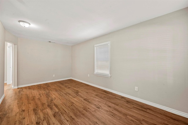 empty room featuring wood-type flooring