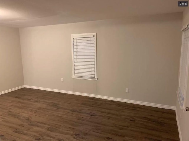 empty room featuring dark wood-type flooring