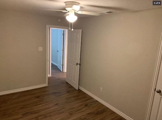 unfurnished room with ceiling fan and dark hardwood / wood-style floors