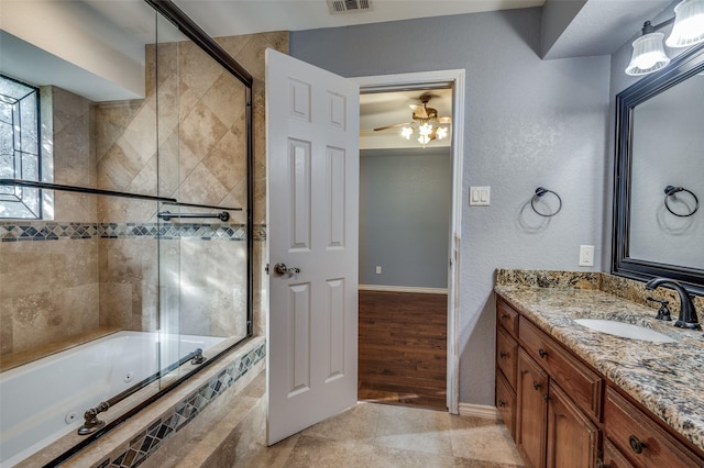 bathroom featuring ceiling fan, tile patterned flooring, shower with separate bathtub, and vanity