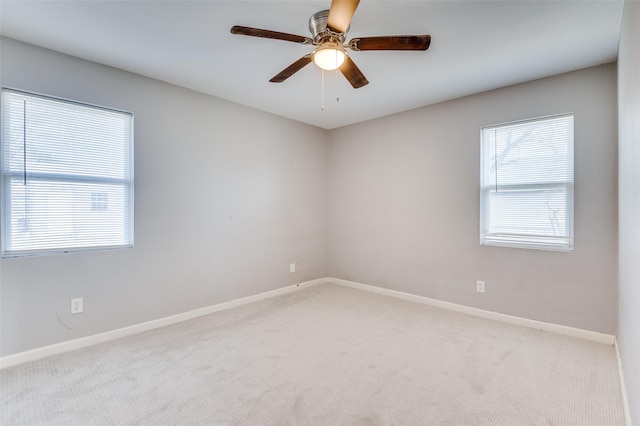 carpeted empty room with ceiling fan