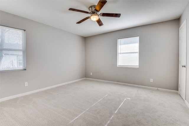 empty room with light carpet and ceiling fan