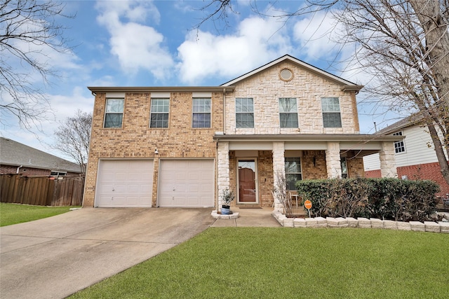 view of front of house with a garage, a front yard, and covered porch