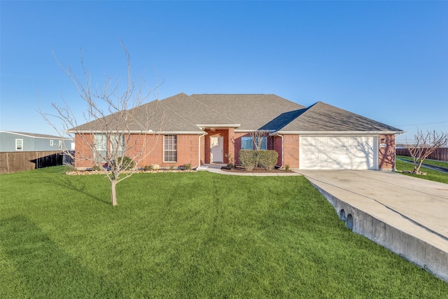 ranch-style home with a front yard and a garage