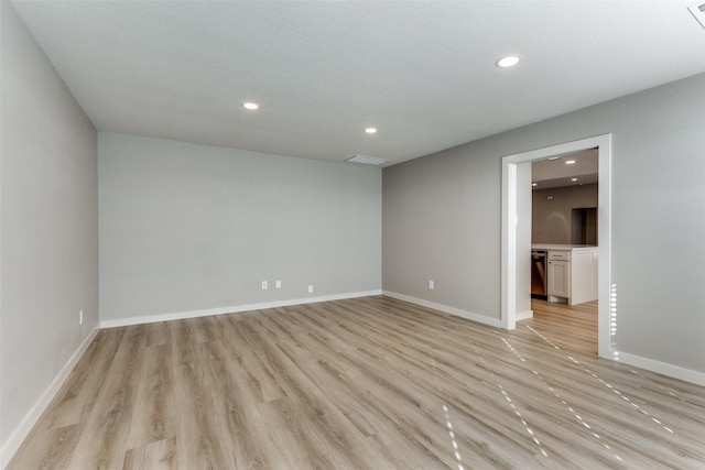 unfurnished room featuring light hardwood / wood-style floors