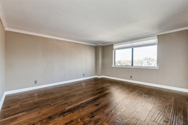 empty room with dark hardwood / wood-style floors and ornamental molding