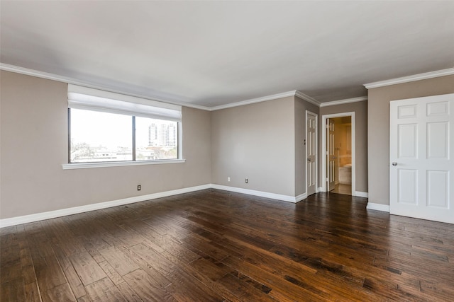 empty room featuring dark hardwood / wood-style flooring and crown molding