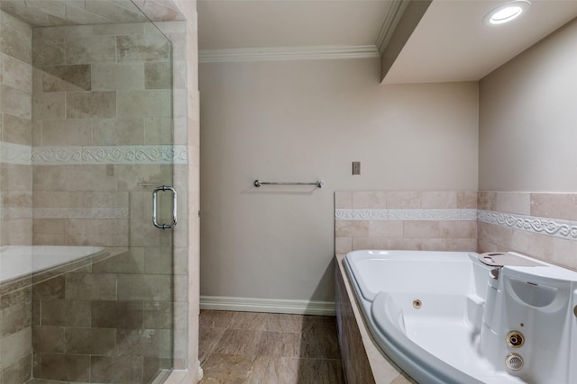 bathroom featuring ornamental molding and shower with separate bathtub