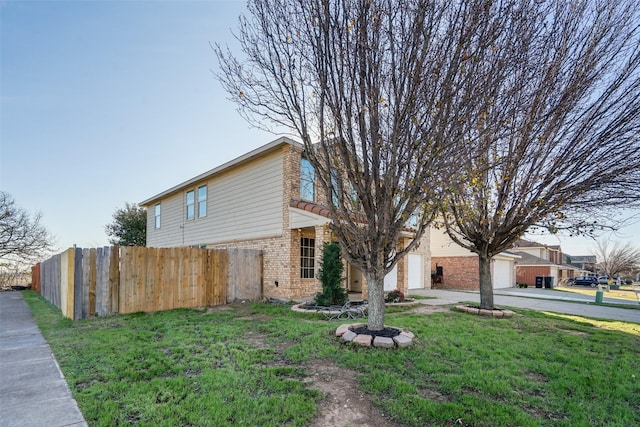 view of property exterior with a yard and a garage