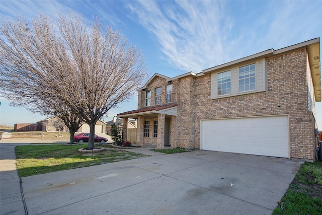 view of front facade featuring a front lawn and a garage