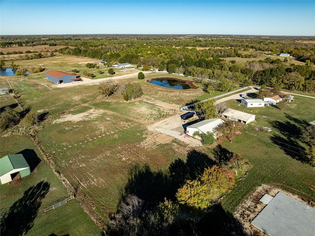 birds eye view of property with a water view and a rural view