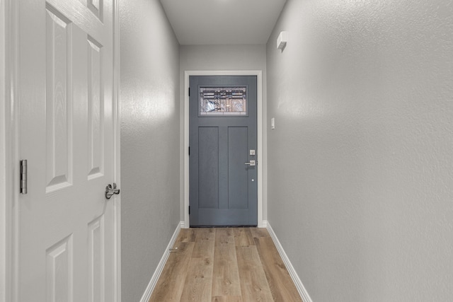 doorway to outside with light hardwood / wood-style floors