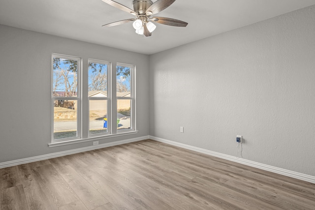 unfurnished room featuring ceiling fan and light hardwood / wood-style flooring