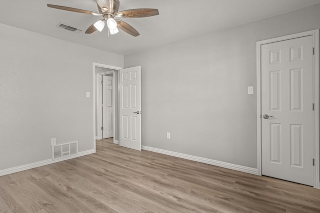 spare room with ceiling fan and light hardwood / wood-style flooring