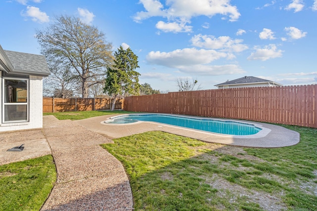 view of pool featuring a patio area and a lawn