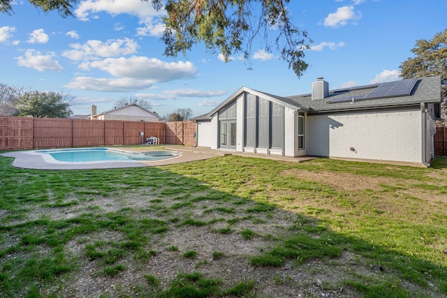 view of yard featuring a fenced in pool and a patio area