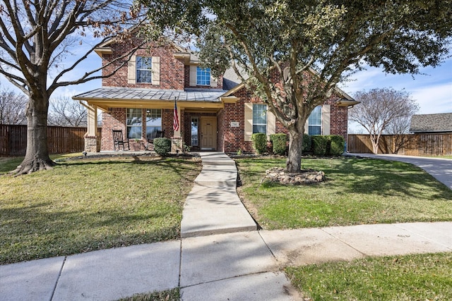 view of front of home with a front yard and a porch