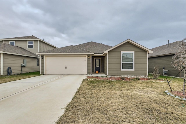 view of front of home with a front lawn and a garage