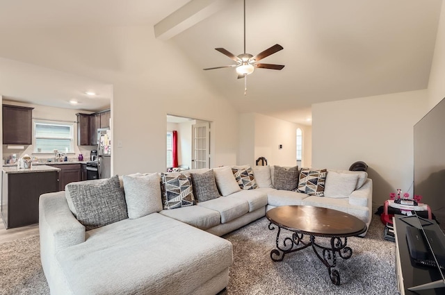 living room featuring high vaulted ceiling, ceiling fan, and beamed ceiling