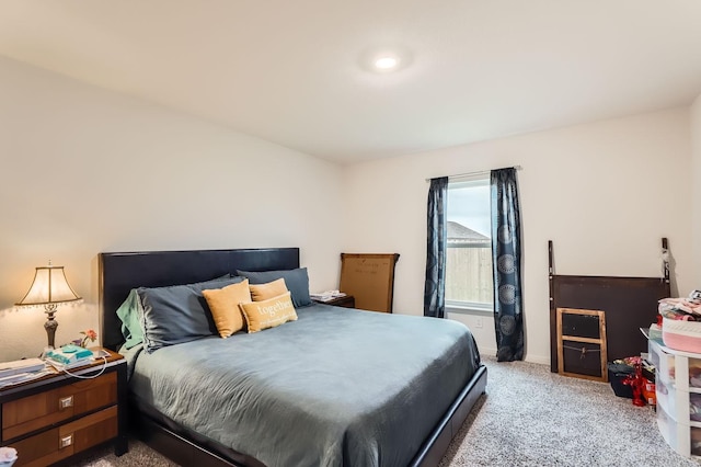 bedroom with light colored carpet