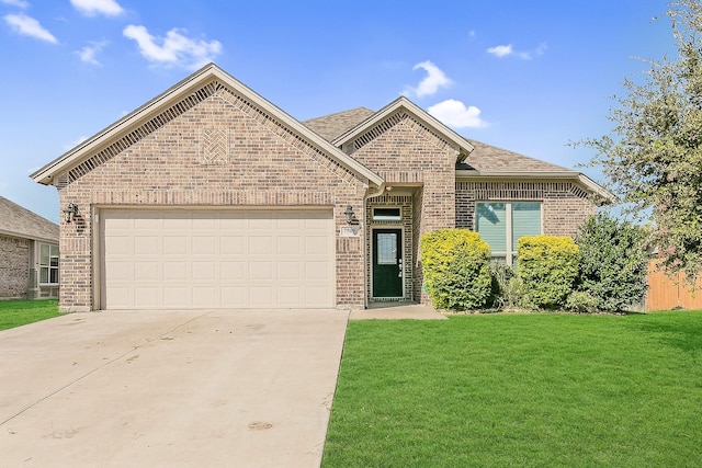 view of property with a garage and a front lawn