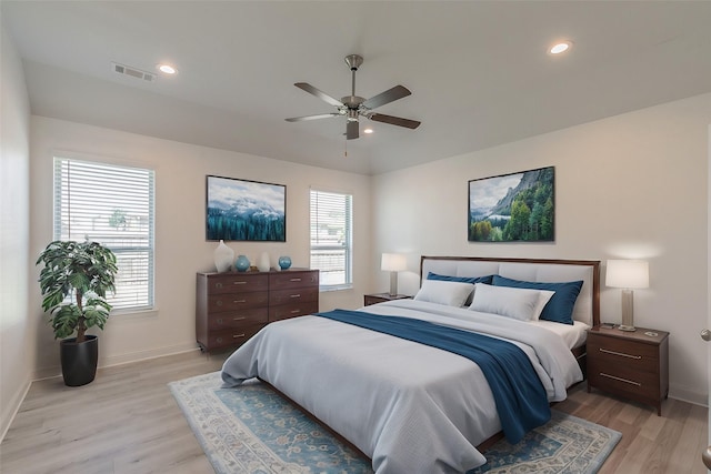 bedroom with ceiling fan and light hardwood / wood-style flooring