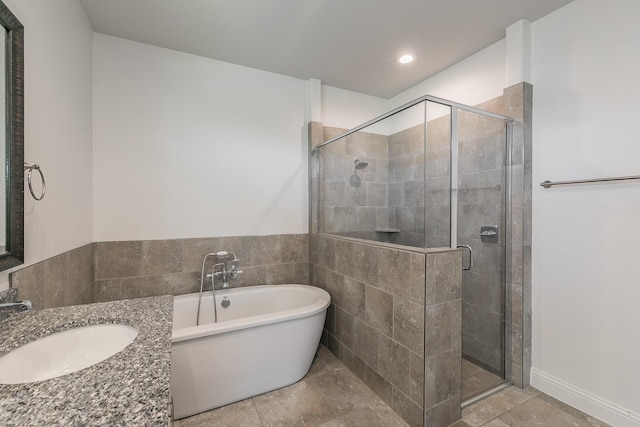 bathroom with sink and shower with separate bathtub