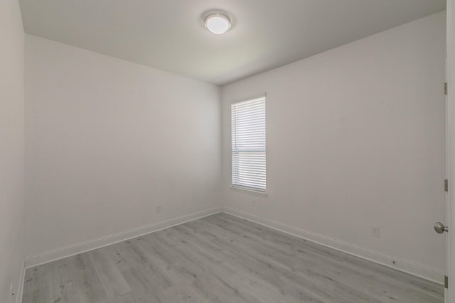 unfurnished room featuring light hardwood / wood-style floors