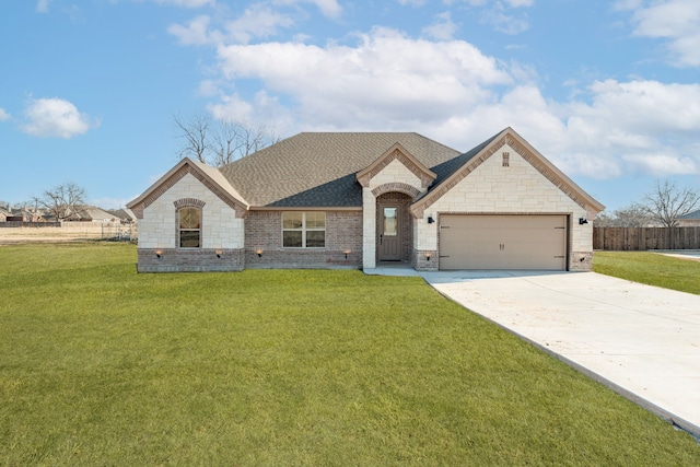 view of front facade with a garage and a front yard