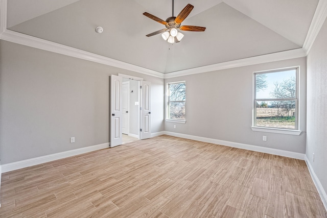 unfurnished room with baseboards, ceiling fan, vaulted ceiling, crown molding, and light wood-style floors