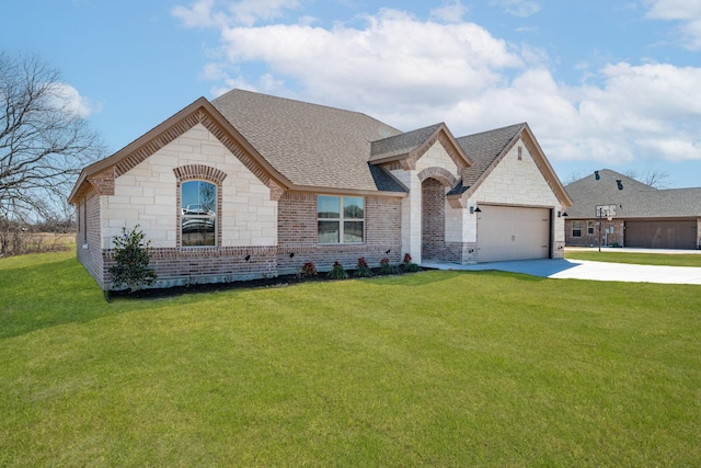 french country inspired facade featuring brick siding, a front yard, a garage, stone siding, and driveway