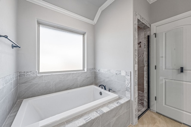 full bathroom with a bath, a stall shower, crown molding, and tile patterned floors