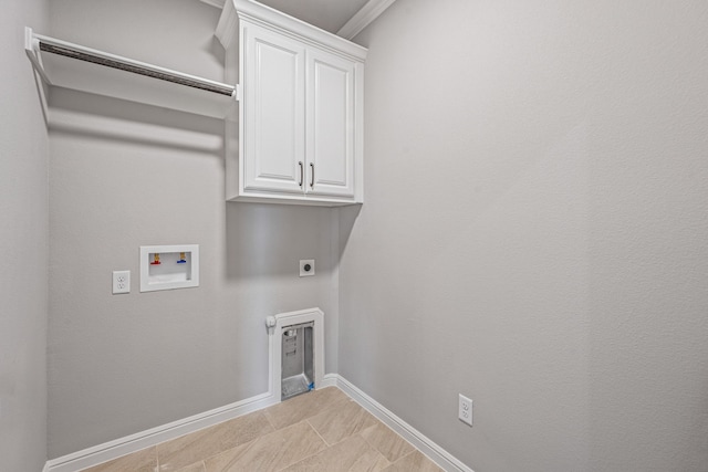 laundry area featuring cabinet space, baseboards, tile patterned floors, hookup for a washing machine, and hookup for an electric dryer