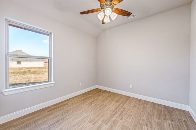 unfurnished room featuring light wood finished floors, baseboards, visible vents, and a ceiling fan