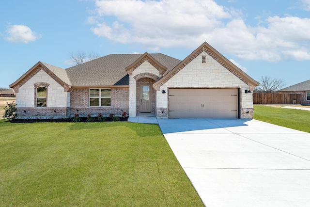 french country inspired facade featuring a garage, concrete driveway, roof with shingles, a front yard, and brick siding