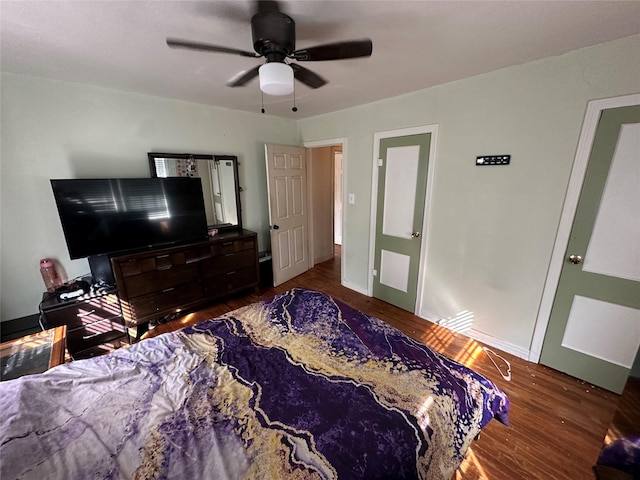 bedroom featuring dark wood-type flooring and ceiling fan