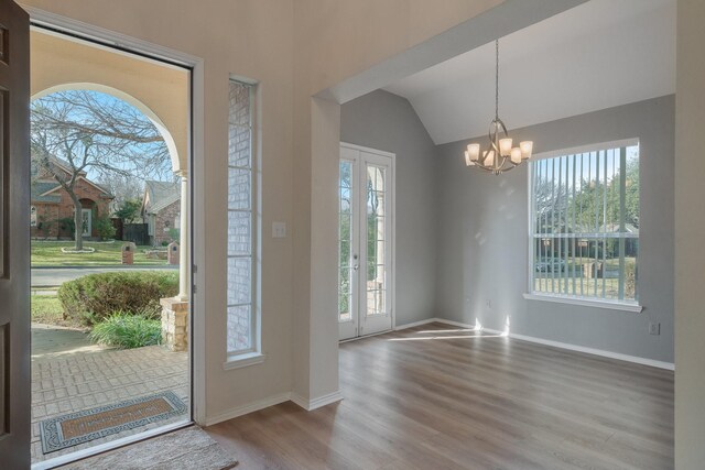 unfurnished dining area featuring light hardwood / wood-style floors, crown molding, and ceiling fan with notable chandelier