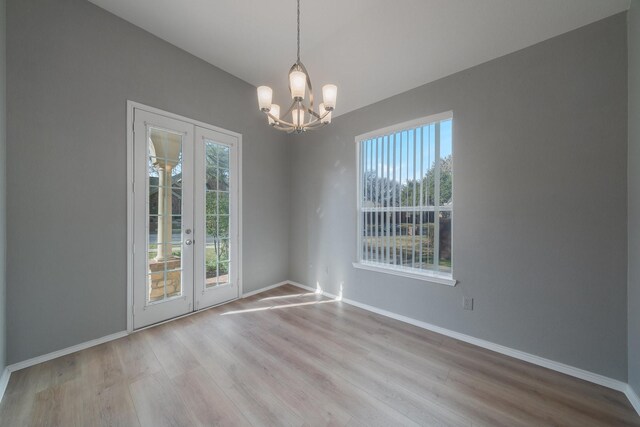 unfurnished living room featuring light wood-type flooring, ceiling fan, and a healthy amount of sunlight