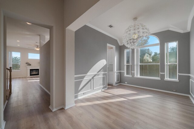 unfurnished living room with ceiling fan and light hardwood / wood-style flooring